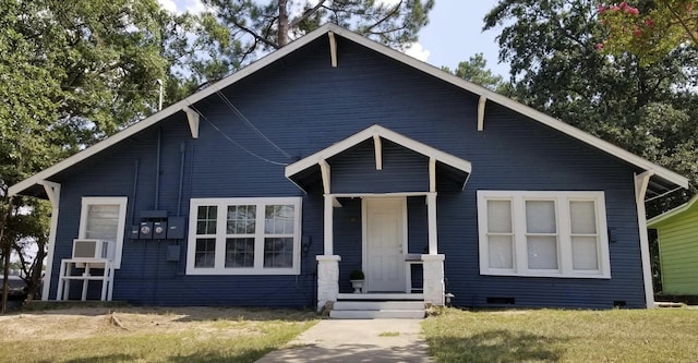 bungalow-style house with a front lawn