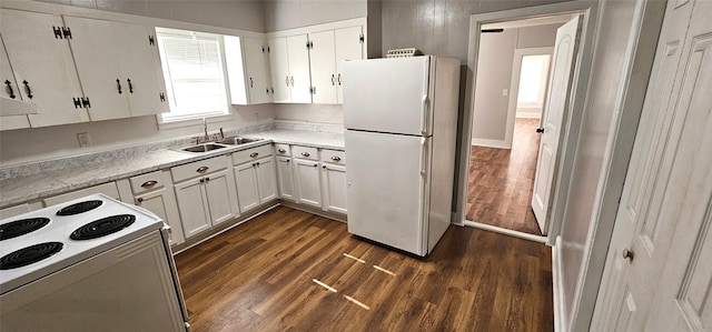 kitchen featuring white cabinets, dark hardwood / wood-style flooring, sink, and white appliances