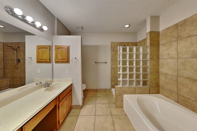 full bathroom with vanity, tile patterned flooring, plus walk in shower, and a textured ceiling