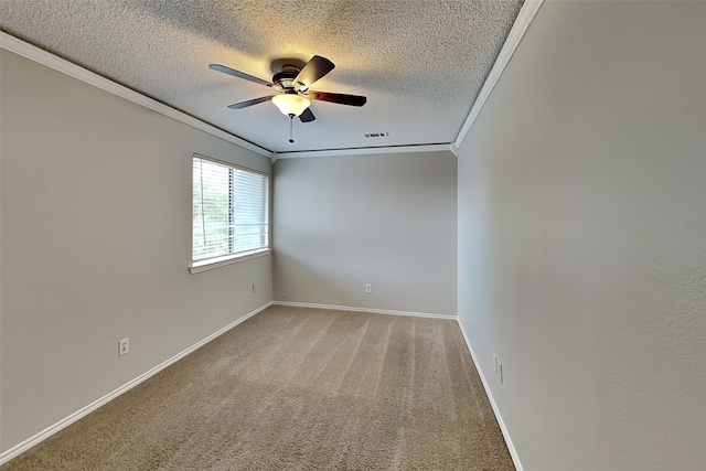 carpeted empty room featuring ceiling fan, a textured ceiling, and ornamental molding