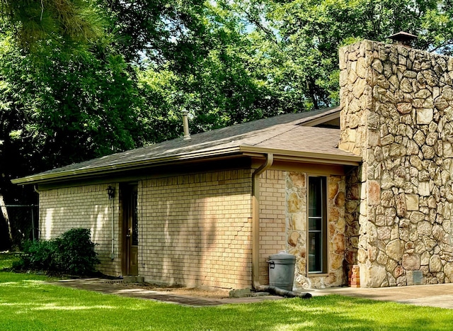 view of property exterior with a lawn