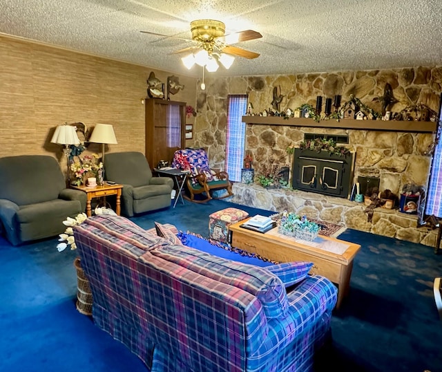 living room featuring a textured ceiling, ceiling fan, and carpet