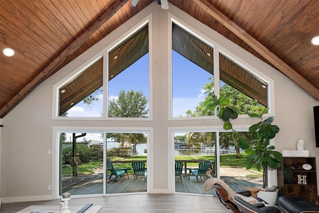 interior space featuring wooden ceiling, hardwood / wood-style floors, and high vaulted ceiling