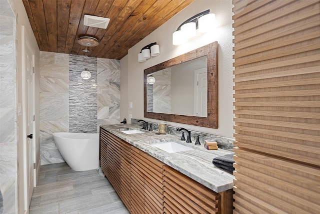 bathroom with wood ceiling, a washtub, vanity, and tile walls