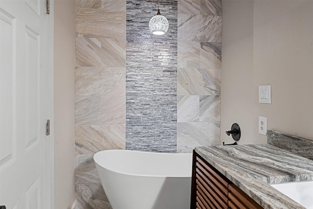 bathroom featuring vanity and a bathing tub