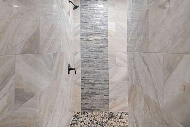 bathroom with tiled shower