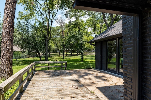 wooden deck with a yard