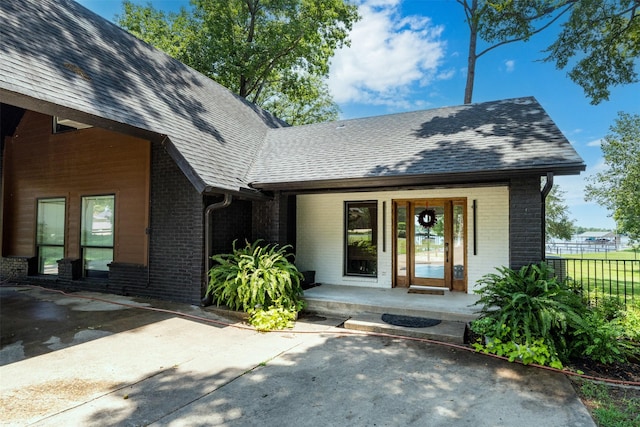 doorway to property featuring a porch