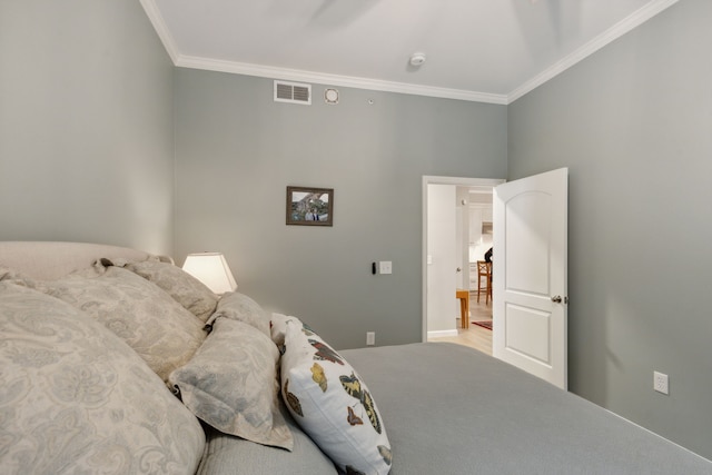 bedroom featuring crown molding