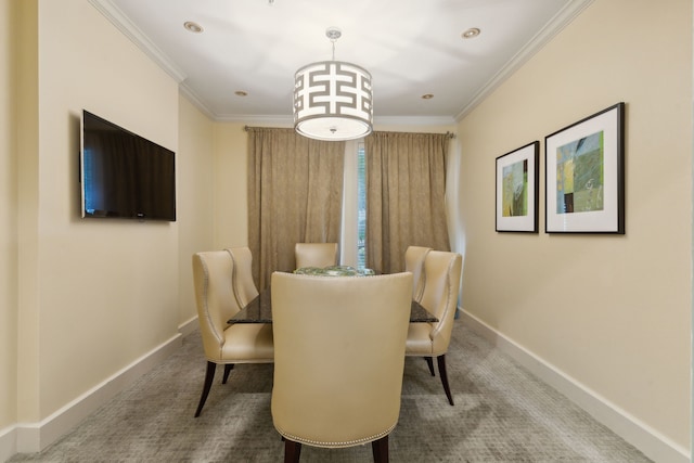 dining room with carpet and ornamental molding