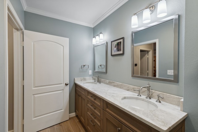 bathroom with vanity and ornamental molding