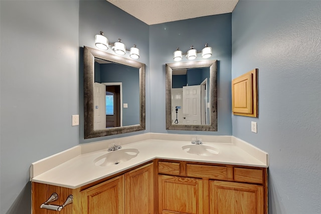 bathroom featuring vanity and a textured ceiling