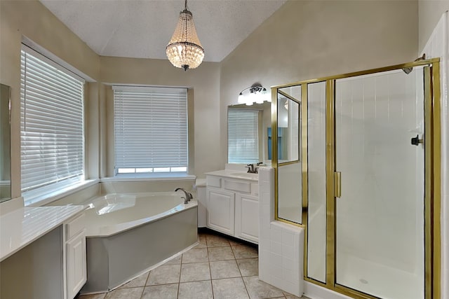 bathroom featuring vanity, a textured ceiling, vaulted ceiling, tile patterned floors, and separate shower and tub