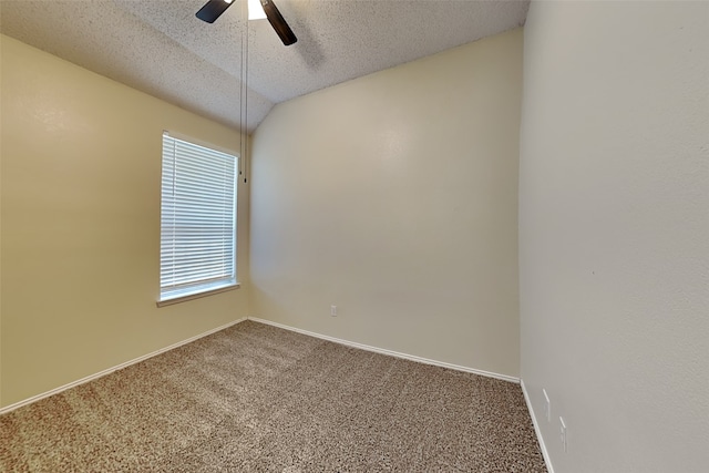 carpeted empty room with ceiling fan, vaulted ceiling, and a textured ceiling