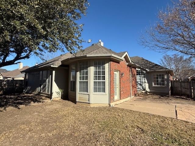 back of house with a patio