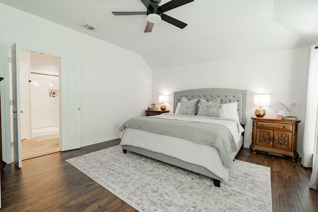 bedroom featuring dark wood-type flooring, ceiling fan, lofted ceiling, and connected bathroom