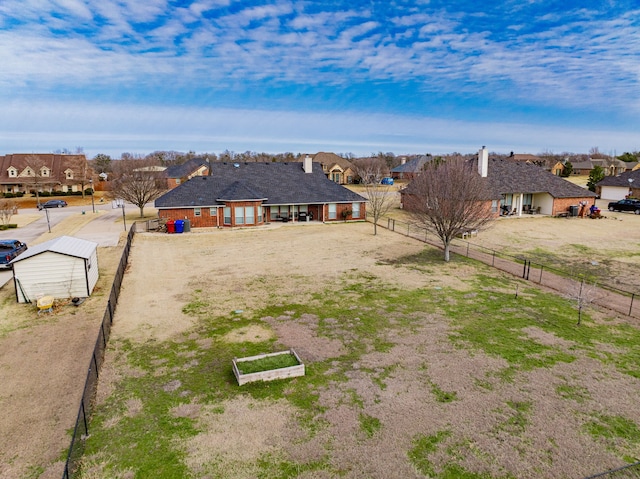 view of yard featuring a storage unit