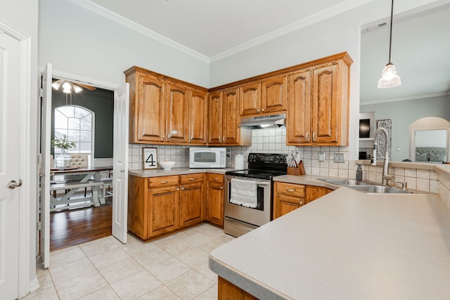 kitchen featuring decorative backsplash, sink, light tile patterned flooring, hanging light fixtures, and stainless steel electric stove