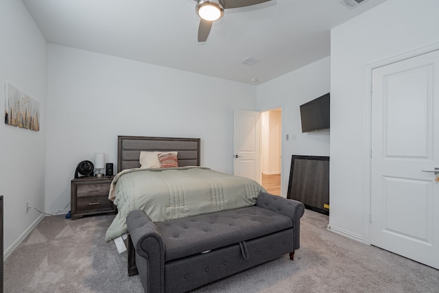 bedroom featuring light carpet and ceiling fan