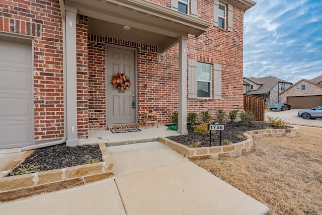 property entrance with a garage