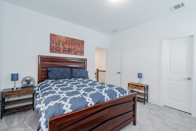 bedroom with light colored carpet