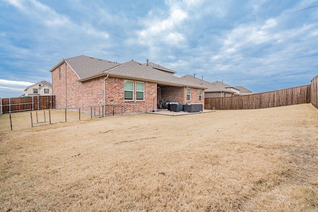 back of property with outdoor lounge area and a patio area