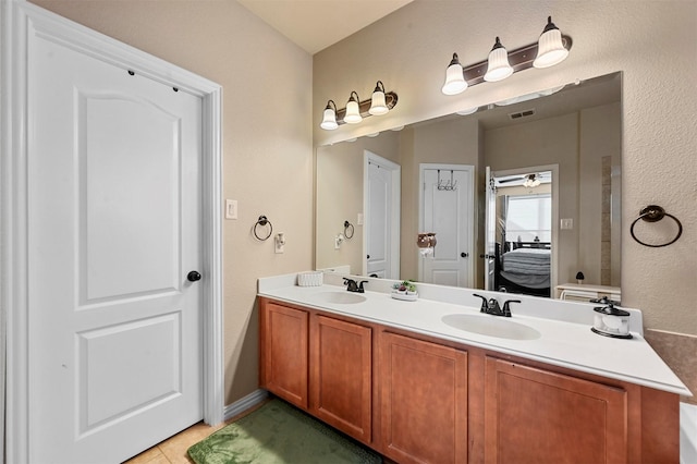 bathroom with tile patterned flooring and vanity