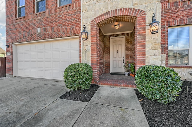 doorway to property featuring a garage