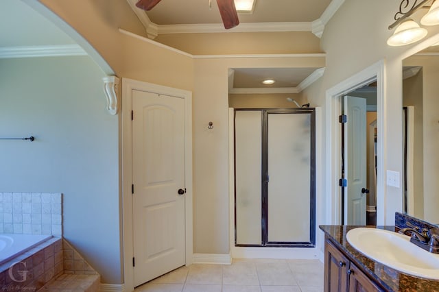 bathroom with ceiling fan, separate shower and tub, tile patterned floors, crown molding, and vanity