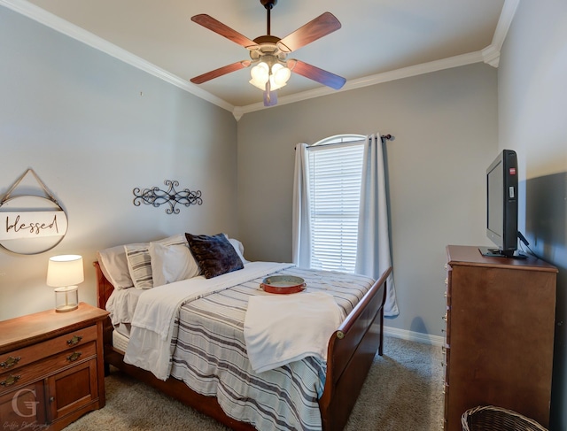 carpeted bedroom featuring ceiling fan and crown molding