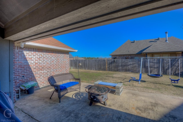 view of patio / terrace with an outdoor fire pit