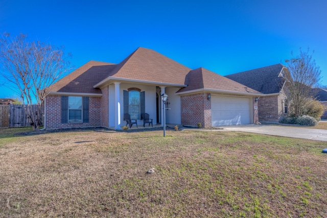 ranch-style home with a front lawn and a garage