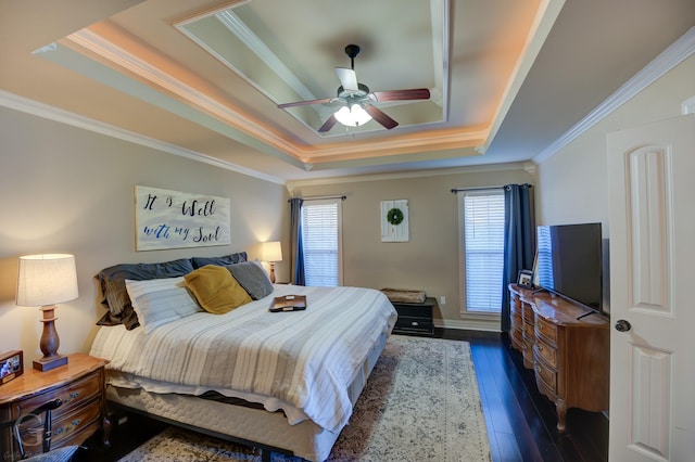 bedroom featuring a raised ceiling, ceiling fan, and crown molding