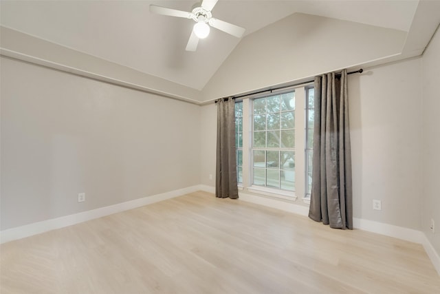 unfurnished room featuring ceiling fan, lofted ceiling, and light hardwood / wood-style flooring