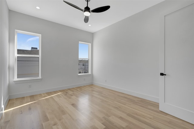 spare room featuring ceiling fan and light hardwood / wood-style floors