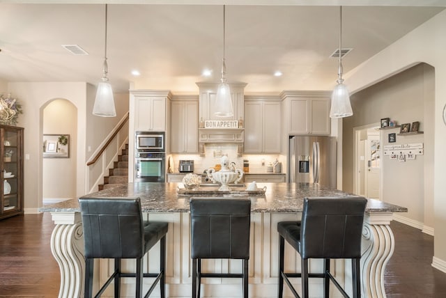1901 Yucatan Dr, Granbury, TX 76048 - kitchen featuring appliances with stainless steel finishes, baseboards, backsplash, recessed lighting, and an island with sink