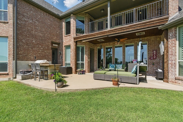 1901 Yucatan Dr, Granbury, TX 76048 - rear view of property featuring a balcony, a patio area, brick siding, and a yard