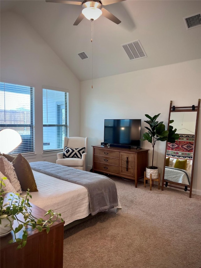 carpeted bedroom with vaulted ceiling and ceiling fan