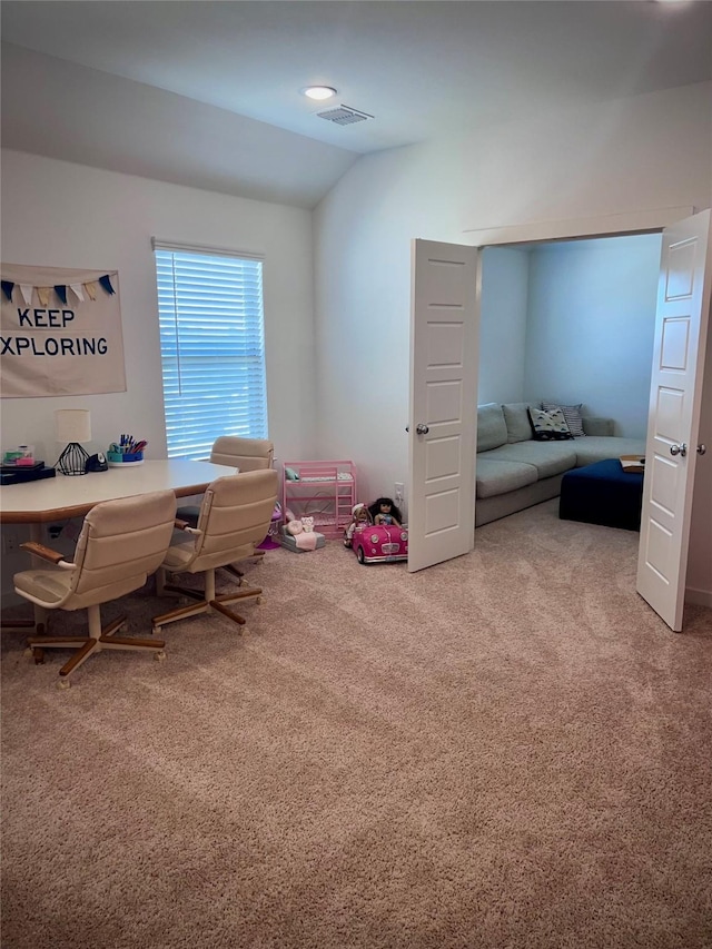 office featuring lofted ceiling and carpet floors