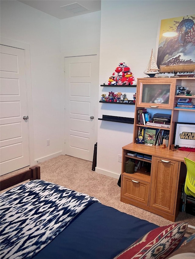 bedroom with light colored carpet