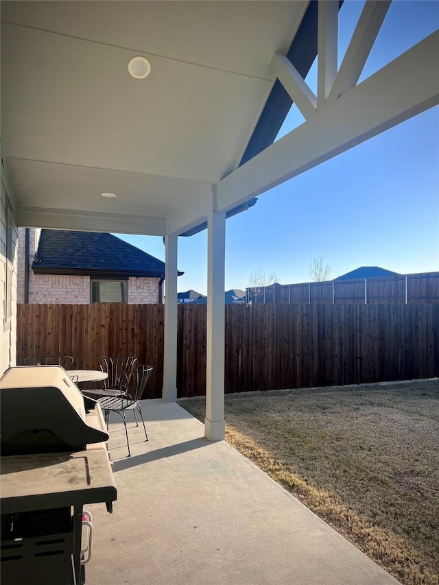 view of patio featuring grilling area and a mountain view