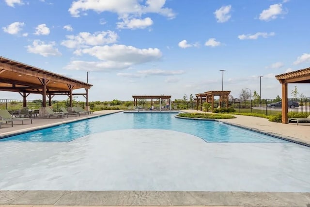 view of swimming pool with a pergola and a patio area