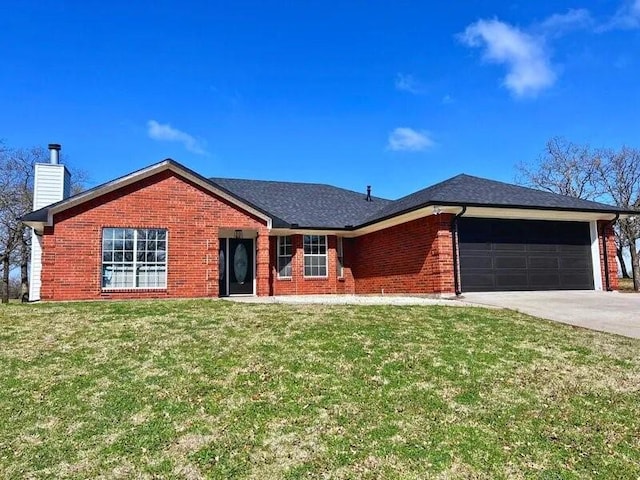 single story home with a garage and a front lawn