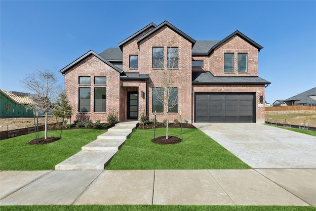 craftsman-style house featuring driveway, brick siding, a front lawn, and an attached garage