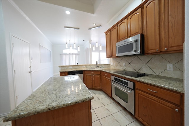 kitchen featuring pendant lighting, sink, crown molding, stainless steel appliances, and a kitchen island