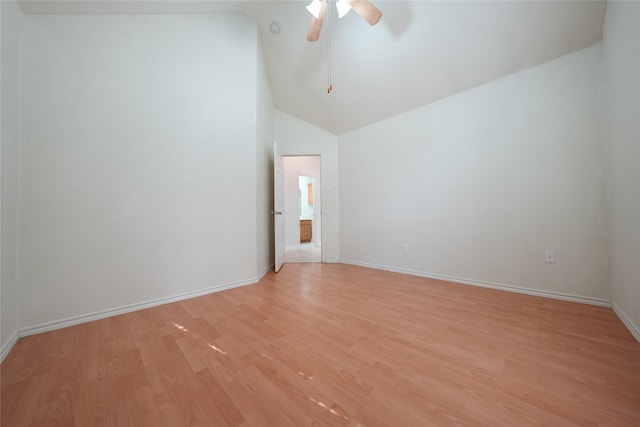 empty room with high vaulted ceiling, ceiling fan, and light wood-type flooring