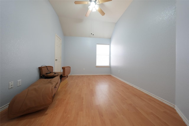 sitting room featuring vaulted ceiling, light hardwood / wood-style floors, and ceiling fan