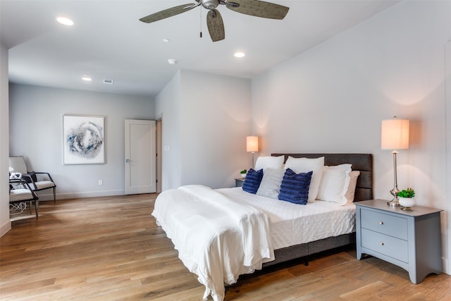 bedroom featuring light wood-type flooring and ceiling fan