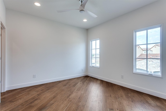 spare room featuring ceiling fan and hardwood / wood-style floors