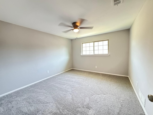 carpeted empty room with ceiling fan